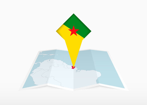 French Guiana is depicted on a folded paper map and pinned location marker with flag of French Guiana.