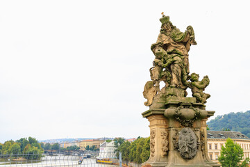 Ancient medieval sculptures on the Charles Bridge. Background with selective focus