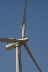 windmill in the foreground, wind power generation