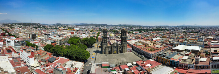 4k drone aerial panorama photo landscape of buildings in puebla city the common park and main church holidays mexico america summer vacations 