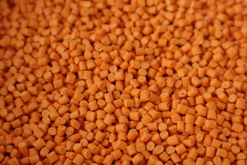Orange pigment. Used for mixing with plastic pellets in production.