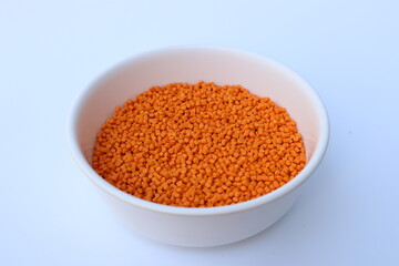 Orange pigment. Used for mixing with plastic pellets in production.