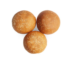 Fresh tasty buns with sesame seeds isolated on white, top view