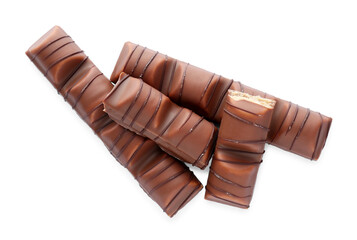 Pieces of tasty chocolate bars on white background, top view