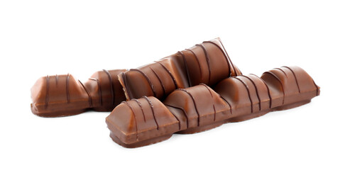 Pieces of tasty chocolate bars on white background