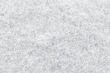 White abrasive cleaning sponge as background, closeup