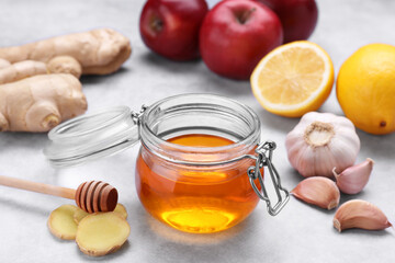 Different natural cold remedies on light grey table. Cough treatment