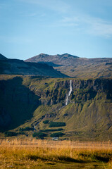 View Bjarnarfoss waterfall on a sunny day in western Iceland