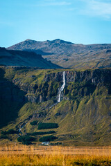 View Bjarnarfoss waterfall on a sunny day in western Iceland