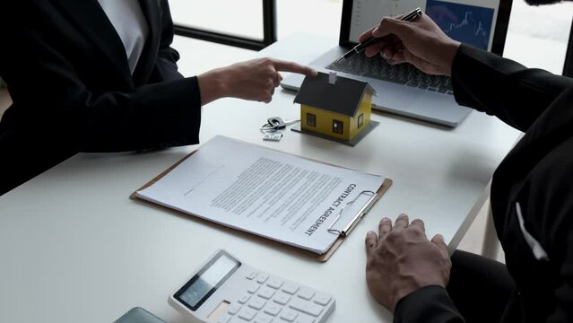 Businessperson real estate purchase agreement contract after sign official offer form is created by the homebuyer's agent and submitted to the seller.