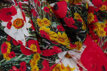 Collection of fashionable fabrics. Samples of different natural fabrics for sewing a fashion collection of clothes. Large selection of fabrics in the store or tailor warehouse.