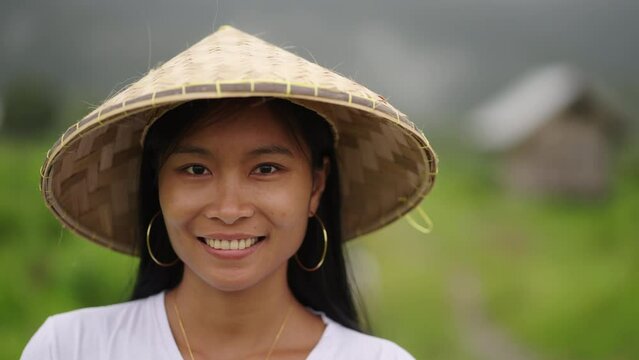 Portrait of happy young asian female rice farmer, poor smallholder