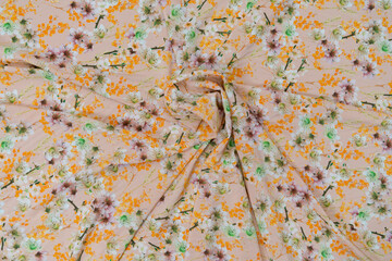 Collection of fashionable fabrics. Samples of different natural fabrics for sewing a fashion collection of clothes. Large selection of fabrics in the store or tailor warehouse.