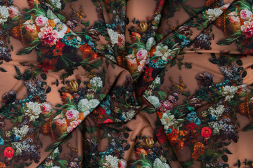 Collection of fashionable fabrics. Samples of different natural fabrics for sewing a fashion collection of clothes. Large selection of fabrics in the store or tailor warehouse.