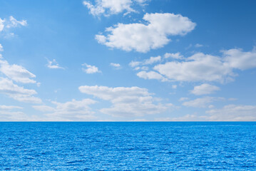 Blue sea and white clouds on sky. Water cloud horizon background. Feeling calm, cool, relaxing. The...