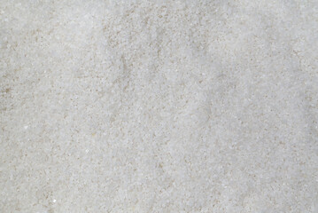 Background from white sea salt. Coarse rock salt texture.