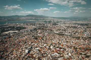 Aerial view of Izmir city with modern skyscrapers and aegean sea - 589368000