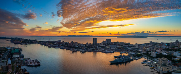 Aerial sunset view of Vladivostok city center and Golden horn bay with a famous bridge