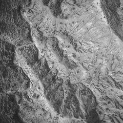 Aerial abstract black and white view of beautiful landscape of Skazka canyon, famous destination in Kyrgyzstan - 589368052
