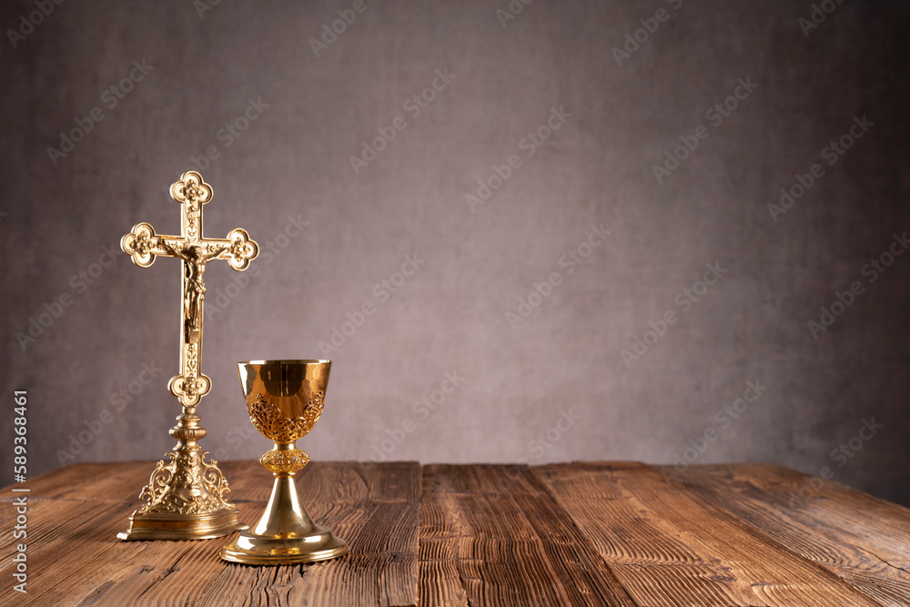 Wall mural Catholic religion concept. Easter.The monstrance and golden chalice on gray background.  - Wall murals
