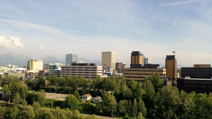 Obraz premium Aerial Establishing shot of downtown Anchorage, Alaska. Bird's eye view of commercial buildings. North America, city. Summer, sunny, day
