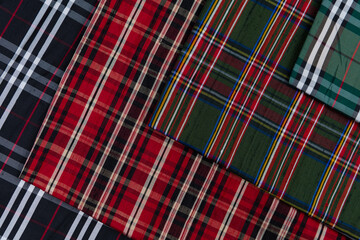 Collection of Scottish fashionable fabrics . Samples of different natural fabrics for sewing a...