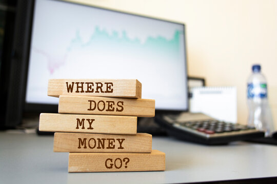 Wooden blocks with words 'Where does my money go?'. Business concept