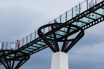 An elevated bridge with a clear background is a tourist attraction.