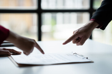 job application and interview concept The head of human resources is explaining the details of completing the resume to be used in the consideration of the applicant to meet the needs of the company