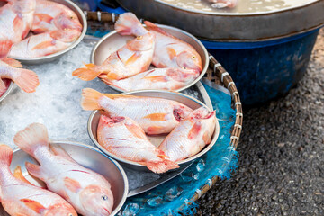 pile of freshly harvested  fish for sale in Asian fish market