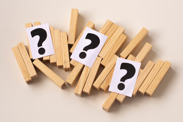 a question mark among the wooden blocks.