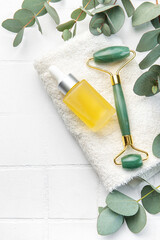 Spa treatment concept. natural spa cosmetics products with eucalyptus oil, massage jade roller,...
