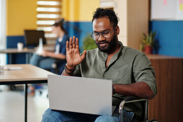 Businessman with disability making video call to coworker