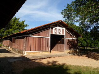 Fototapeta na wymiar old wooden horse house in the woods