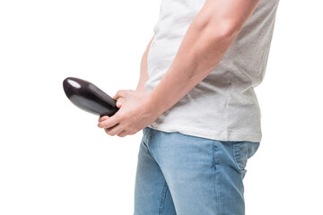 Guy crop view holding eggplant at crotch level imitating penis erection isolated on white