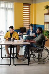 Diverse marketing team working in office on big project