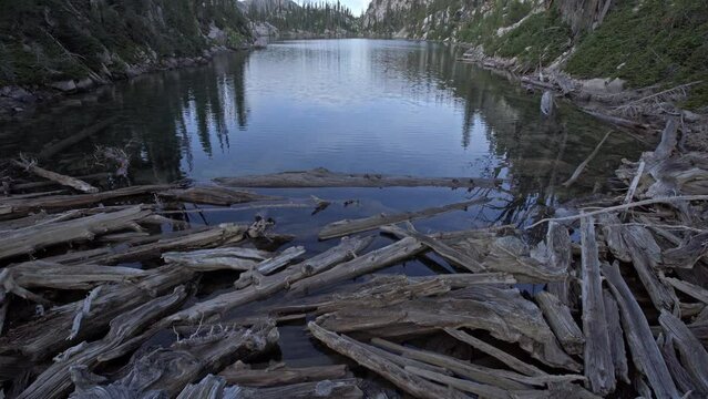 View from log jam at end of scenic alpine lake in Sawtooth mountains Idaho
