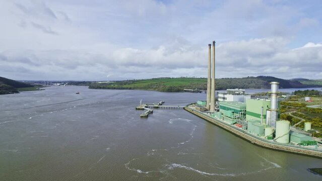 Waterford Estuary real reveal of Great Island electricity power station Wexford and upriver on the river Suir Waterford Port and on the skyline Waterford City