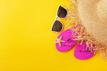 Flip flops straw hat sunglesses and starfish on yellow background vacation travel planning mockup