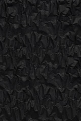 black crumpeled wrapping rough paper pattern for background