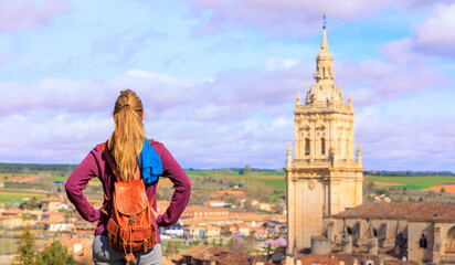 Woman tourist looking at cathedral of Burgo de Osma-Castile and Leon in Spain