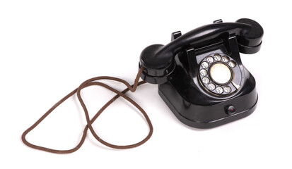 Old black telephone set on a white background