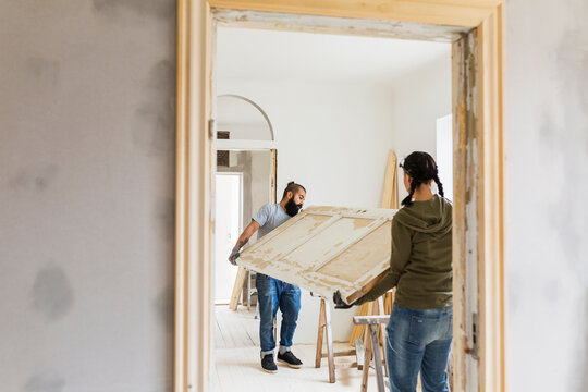 Couple carrying door