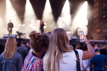 Friends having fun at music concert