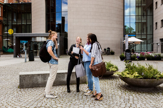 Students meeting up for study session outside library