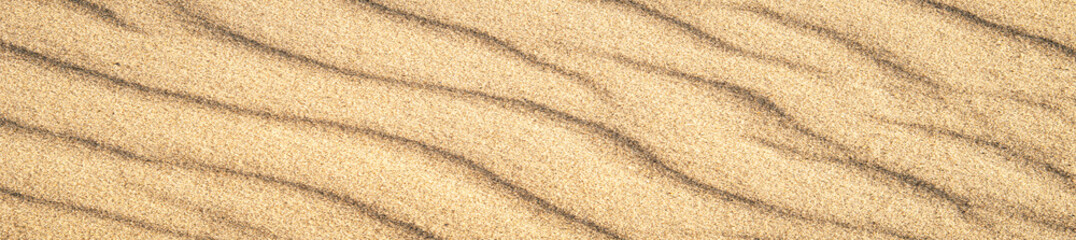 banner of closeup of sand pattern of a beach in the summer. Vacation and sea travel background