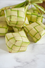 ketupat or rice dumpling is alocal delicacy duting the festive season, ramadhan. ketupat, a natural rice casing made from young coconut leaves for cooking rice