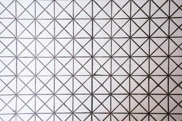 Triangle pattern white ceramic tiles on the floor