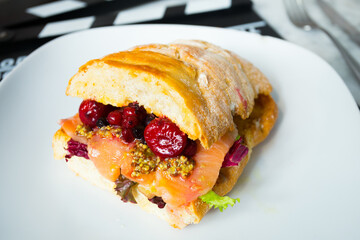 Delicious healthy salmon sandwich with vegetables