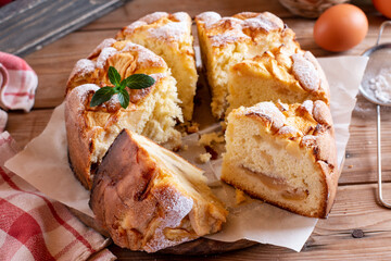 Sponge cake or chiffon cake with apples, so soft and delicious with ingredients: eggs, flour, apples on wooden table. Homemade bakery concept for background and wallpaper.